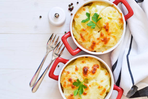 istock Potato casserole with bechemel sauce and cheese on the kitchen table. Top view. 1139994525