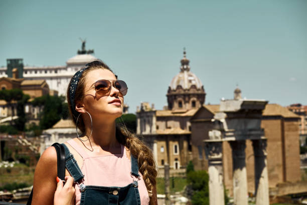 istock Young woman enjoying Rome colosseum 1139998449
