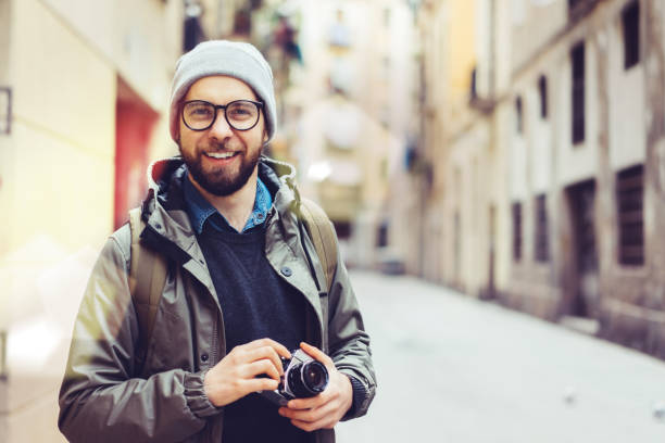 istock Male tourist with retro camera 1140002446