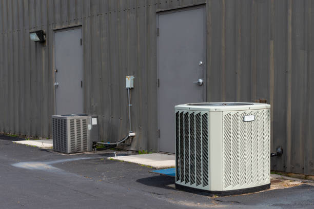 istock Commercial Air Conditioners Outside Aging Office Complex 1140006445