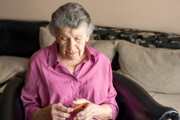 istock An old women knitting 1140007701