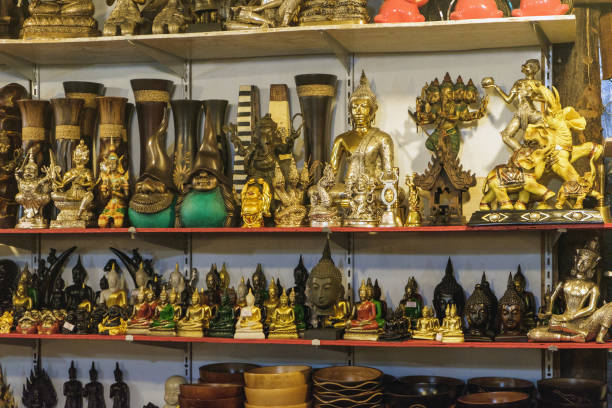 istock Buddhist statuettes and souvenirs at night market 1140008031