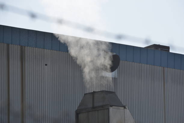 A smoke from the factory chimney polluting the environment A smoke from the factory chimney polluting the environment barbed wire wire factory sky stock pictures, royalty-free photos & images