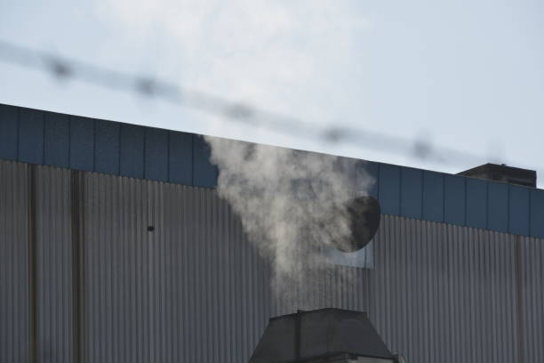 A smoke from the factory chimney polluting the environment A smoke from the factory chimney polluting the environment barbed wire wire factory sky stock pictures, royalty-free photos & images