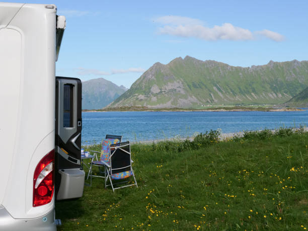 istock Camper car on beach, Lofoten islands, Norway 1140012418