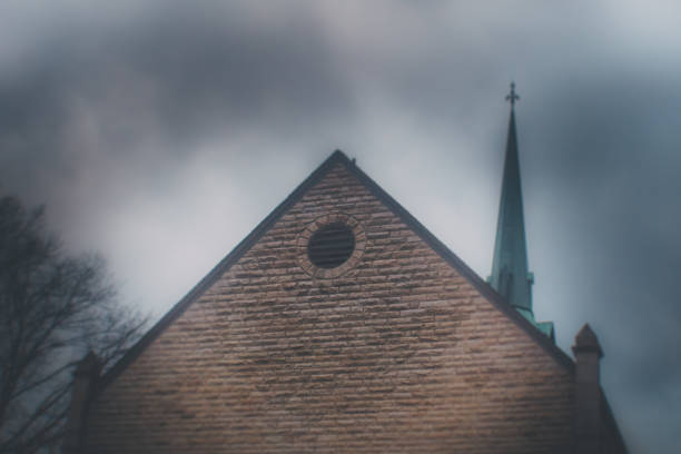 Old church building with smoke and fog