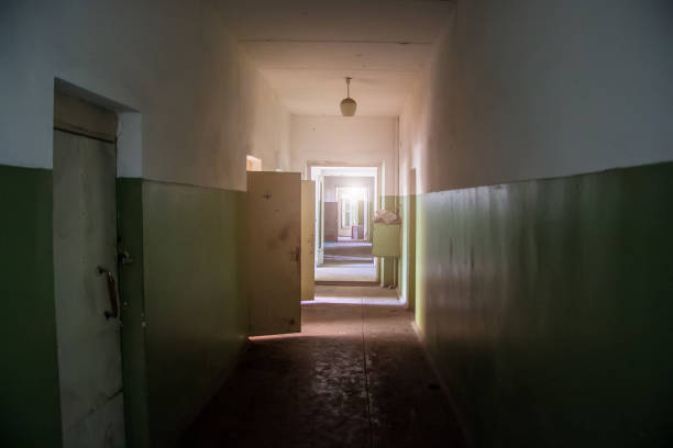 istock Dark creepy corridor of abandoned building 1140014915