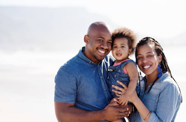 istock Young family on the beach 1140015509