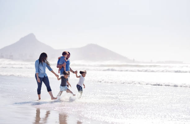 istock Family having fun on beach holiday 1140015663