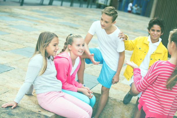 istock Five kids are communicating about football on walk 1140018682