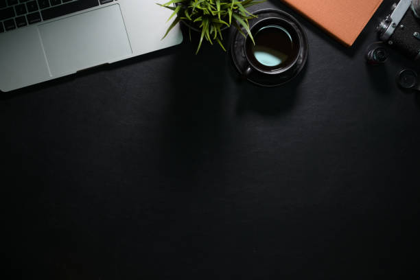 istock Office dark desk table with computer and supplies. Top view with copy space 1140022753