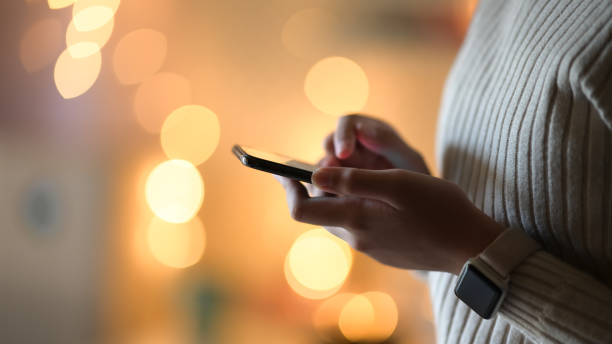 istock Girl and mobile phone over bokeh night 1140023512