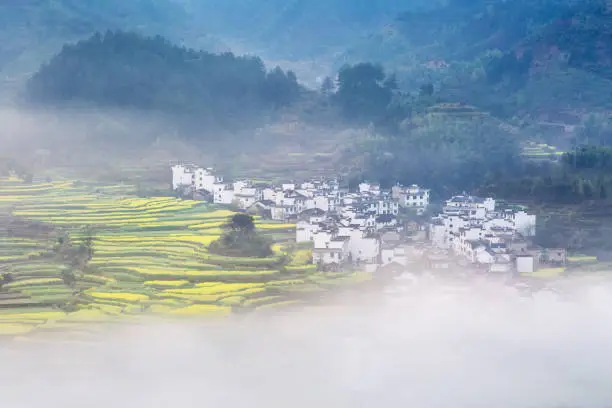 Photo of cloud fog ethereal mountain village