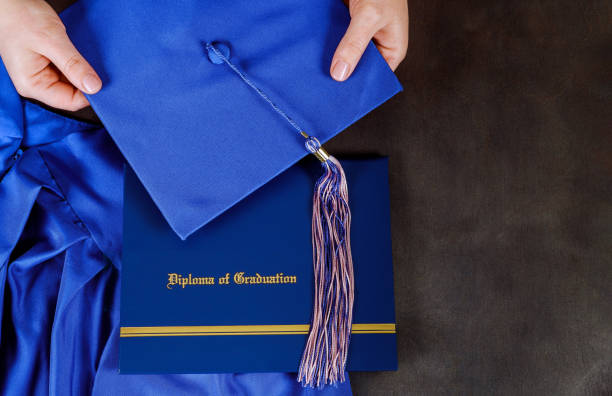 istock A graduation certificate diploma with graduation hat with empty space 1140030284