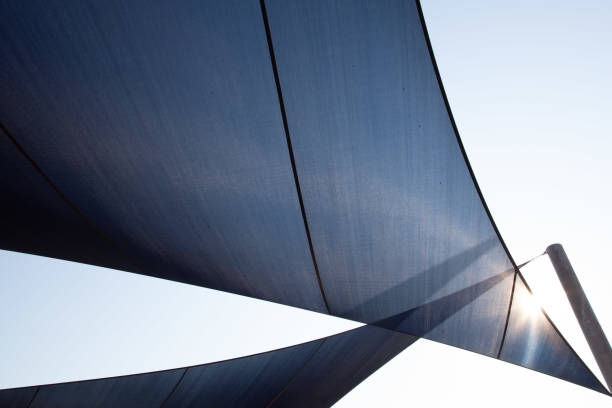 istock Outdoors shade with sun shining through against sky with copy space 1140032230