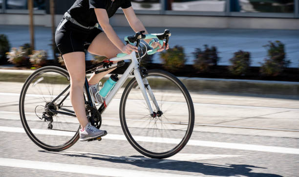 Woman cycling to keep fit