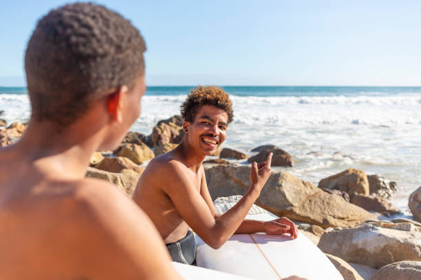istock Young Men Surfers Looking at the Waves Before a Surf 1140036426