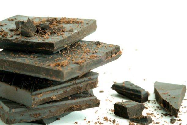 istock Chocolates are cut into pieces on a white background. Snack ideas 1140036667