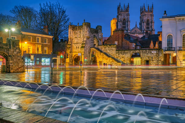 Bootham Bar and the famous York Minster Bootham Bar and the famous York Minster at night york yorkshire stock pictures, royalty-free photos & images