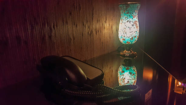 istock Courtesy telephone in hotel lobby next to a lamp 1140040317