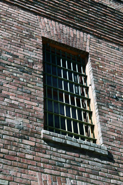 istock Brick building with steel bars in windows 1140041977