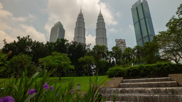 kuala lumpur city center day time famous park fountain towers view panorama 4k timelapse malaysia