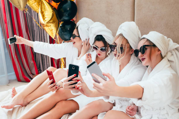istock bathrobe girls party selfie joy fun lifestyle 1140058179