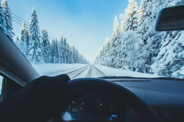 Photo of Winter road view from car cabin. Photo from Kajaani, Finland.