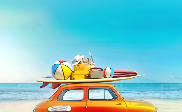 Small retro car with baggage, luggage and beach equipment on the roof, fully packed, ready for summer vacation, concept of a road trip with family and friends, dream destination, very vivid colors with dominant blue sky and ocean and bright orange car. stock photo