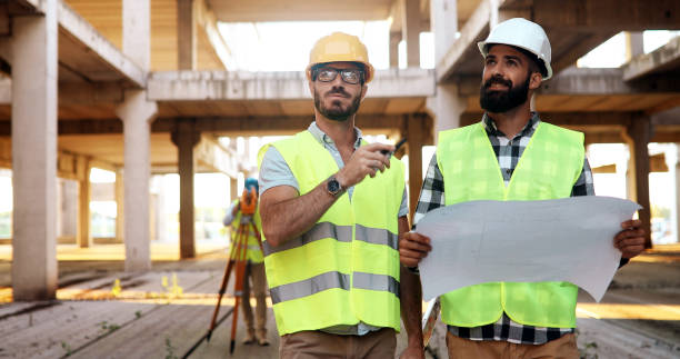 istock Portrait of construction engineers working on building site 1140063291