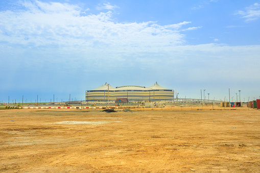 Al Khor, Qatar - February 23, 2019: At Bayt Stadium with the infrastructures still under construction, is one of 12 venues used in 2022 FIFA World Cup. It will host one of the two semi-finals in 2022.