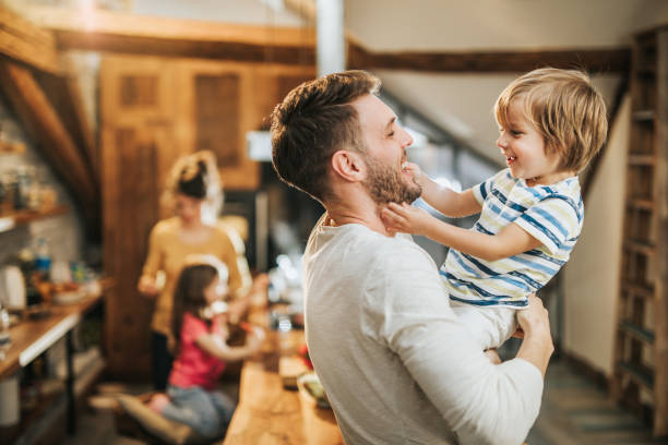 istock Happy little boy having fun with his father at home. 1140066140