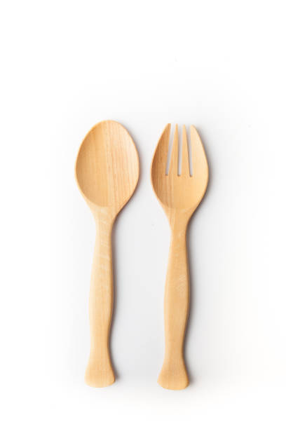 istock Wooden spoon and fork, white background. Wooden kitchenware 1140067287