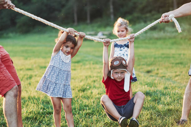 istock What a ride. Pulling a rope game going so fun. Thats was is looks like to have good parents who like nature and action 1140067415