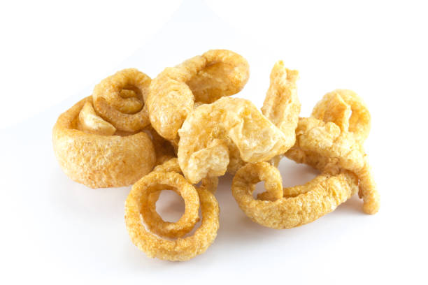 istock Pork snack, Pork rind, Pork scratching or pork crackling on white background 1140068544