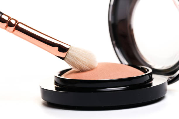 istock eye shadow, blush, powder, sculptor in a pack with make up brushes on a white background. Isolated on white. - Image 1140068921