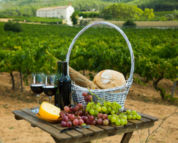 istock Red wine with cheese, bread in basket and grapes 1140069976