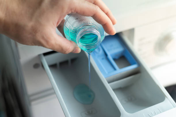 istock Filling detergent in the washing machine dispenser compartment 1140070271