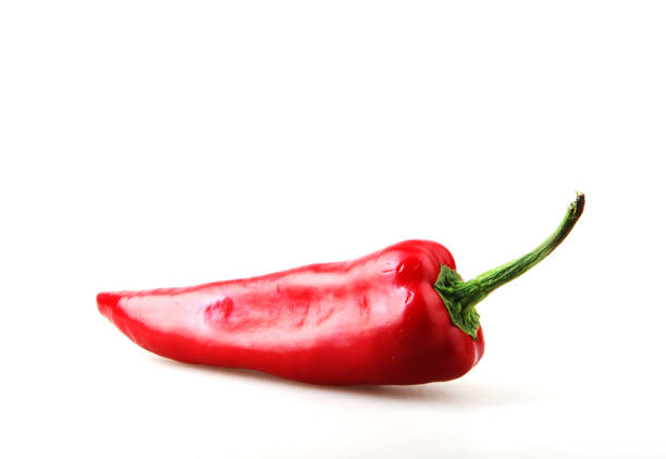 Close-Up Of Red Chili Pepper Against White Background