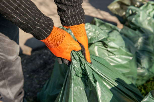 istock man picking up trash cleaning in the street 1140072472