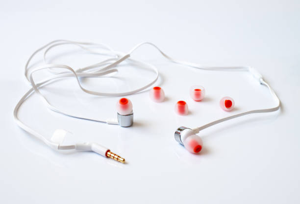 istock The white channel earphones on a white background 1140073277