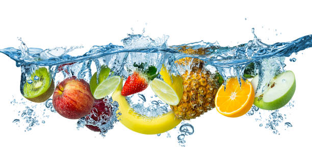 fresh multi fruits splashing into blue clear water splash healthy food diet freshness concept isolated white background fresh multi fruits splashing into blue clear water splash healthy food diet freshness concept isolated on white background tropical fruit photos stock pictures, royalty-free photos & images