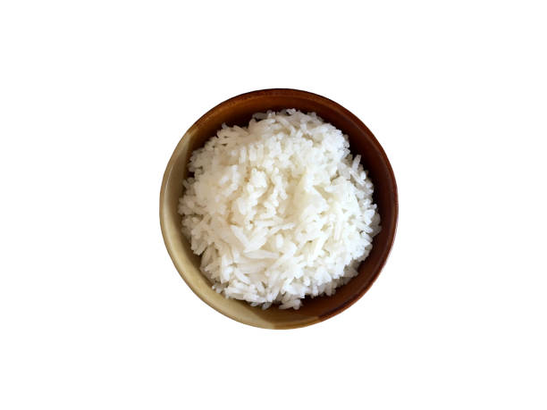 Boiled rice in brown bowl top view isolated on white background Boiled rice in brown bowl top view isolated on white background CUP OF RICE stock pictures, royalty-free photos & images