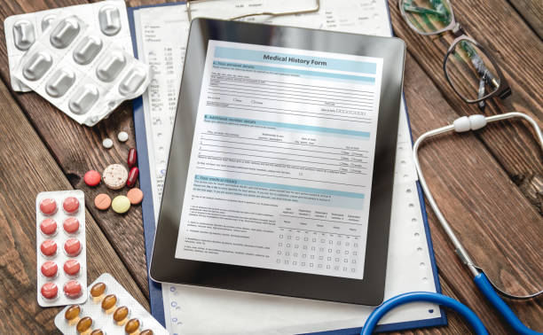 patientenmedizin auf tablet - document healthcare and medicine stethoscope history stock-fotos und bilder