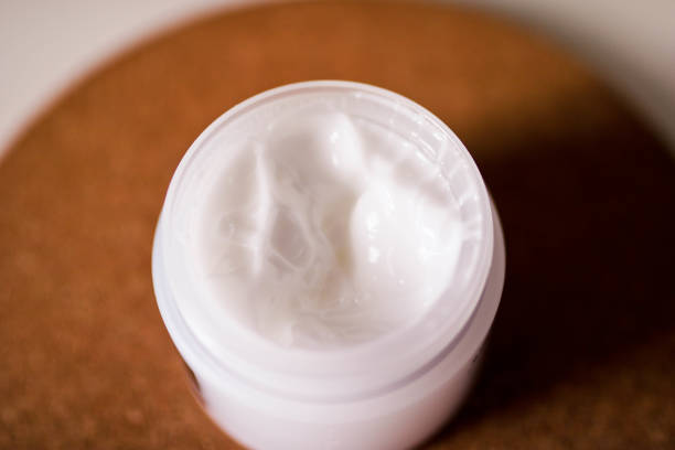 istock Open jar with body cream close up view. Textured body cream. 1140078172