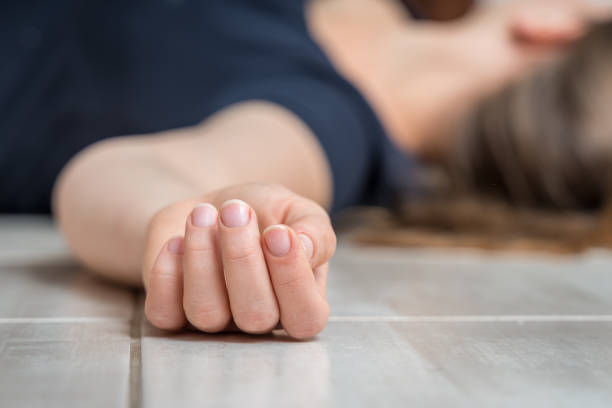 istock Dead woman lying on the white floor 1140080051