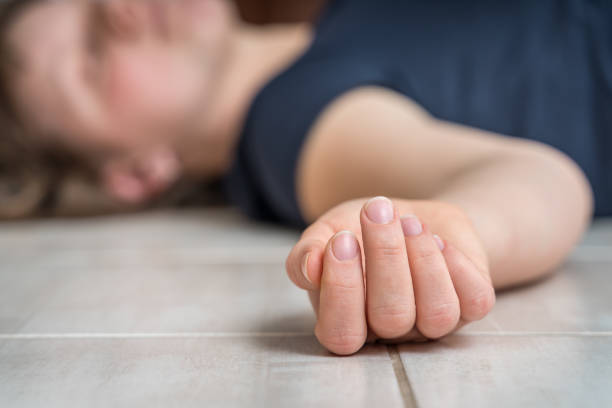 istock Dead woman lying on the white floor 1140080060