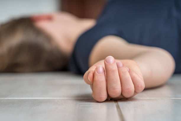istock Dead woman lying on the white floor 1140080074