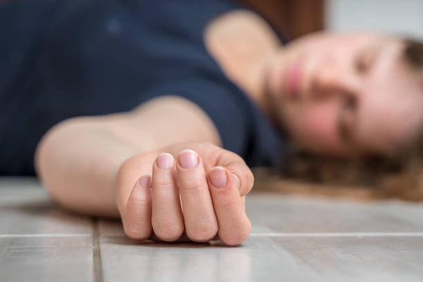 istock Dead woman lying on the white floor 1140080089