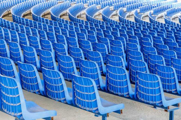 istock Rows of blue plastic chairs on a metal base  in rows around the circle in the hall for business presentations 1140080659